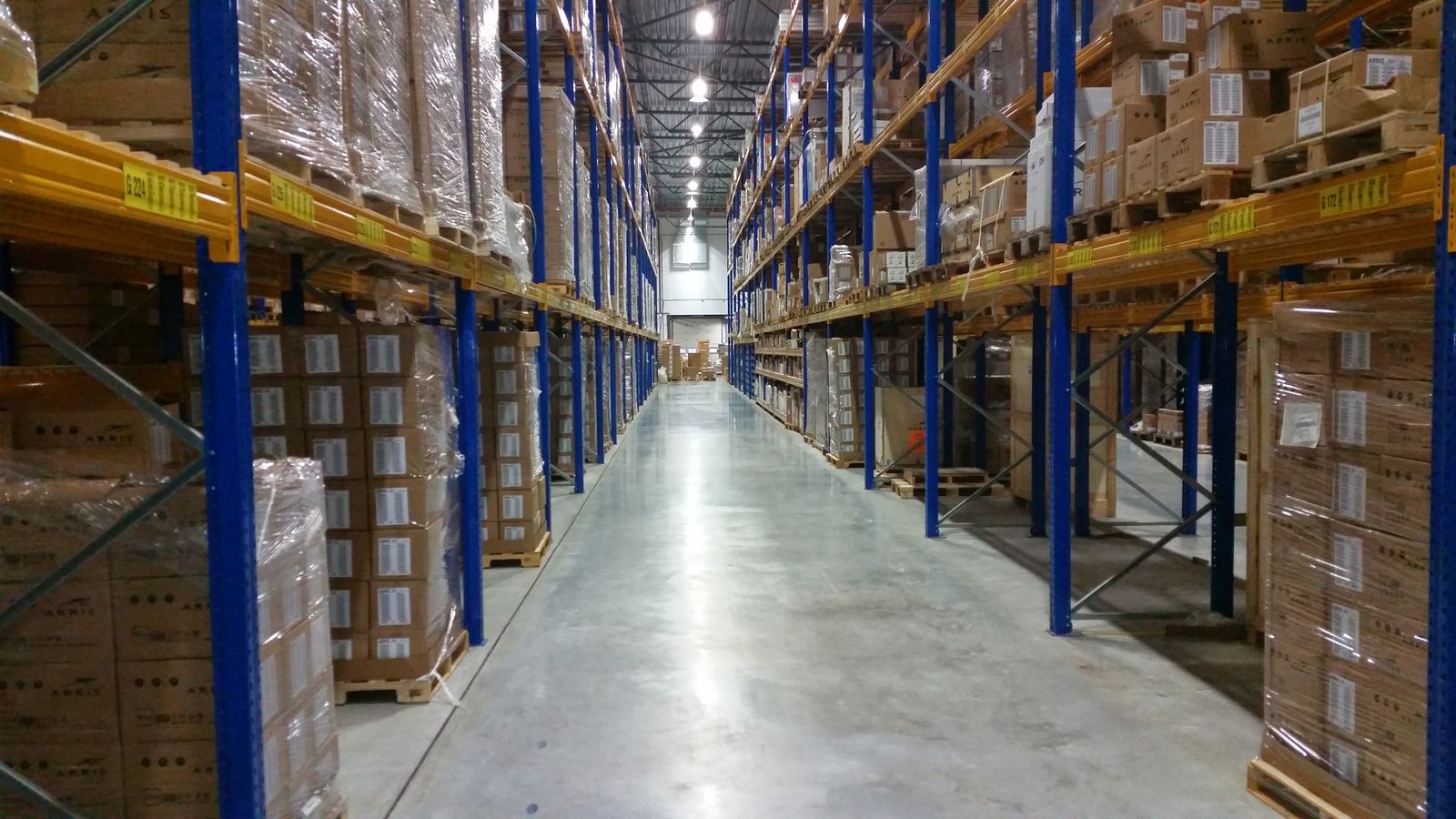 Cartons arranged in a warehouse aisle
